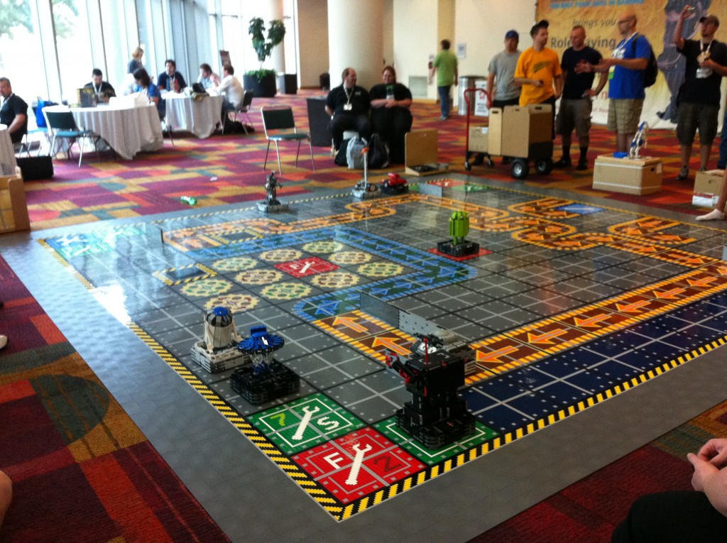 Someone made a huge Robo-Rally game mat with by LEGO Minstorm robots. You actually could play, programing the robots per the board game rules!